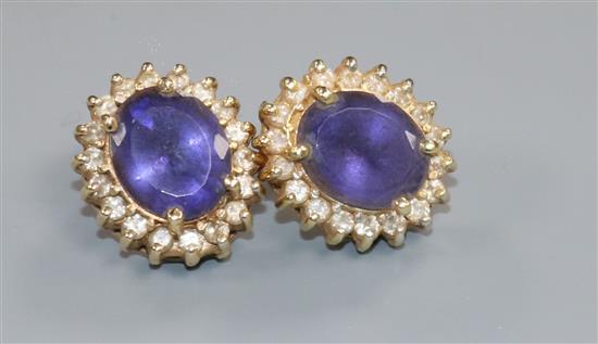 A pair of 14ct gold, amethyst and diamond oval cluster ear studs.